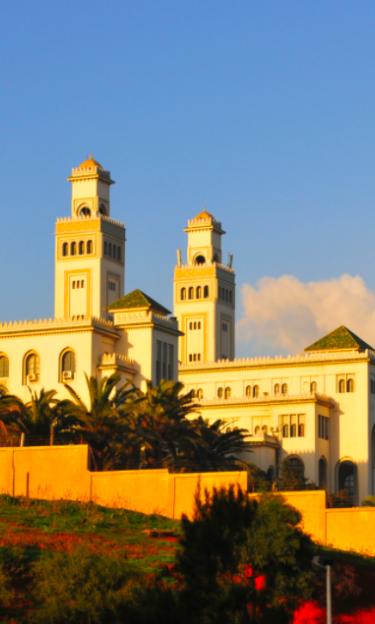 Image features a university building in Algeria
