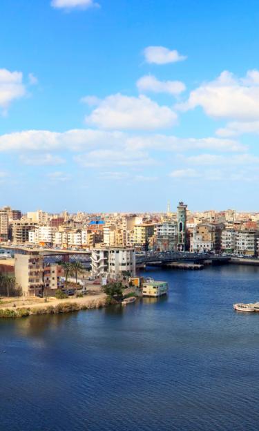 Image features a panorama of the harbour and city of Damietta, Egypt.