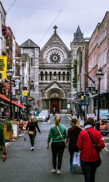 Image features a busy street in Dublin, UK. 