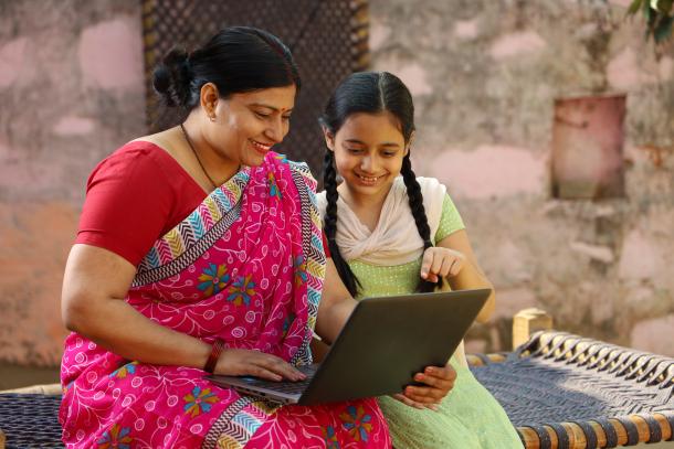 woman and girl on laptop